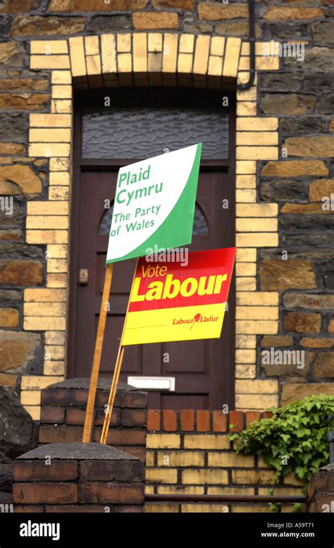 Plaid Cymru The Party Of Wales And Wales Labour Party Placards Outside Terraced Houses In The