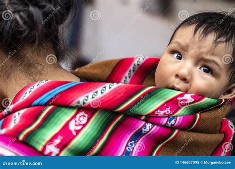 Peruvian Indigenous Mother Carries Her Baby Son On Her Back Editorial
