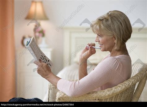 Woman Doing Crossword Puzzle Royalty Free Photo 24067364