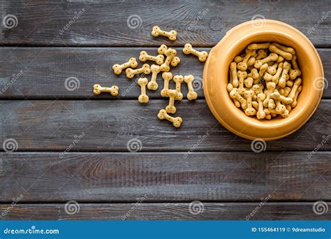 Dog Dry Food In Bowl On Wooden Background Top View Mock Up Stock Image