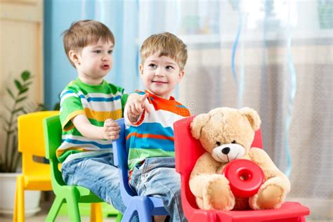 Two Little Boys Playing Role Game In Daycare Stock Photo Image Of