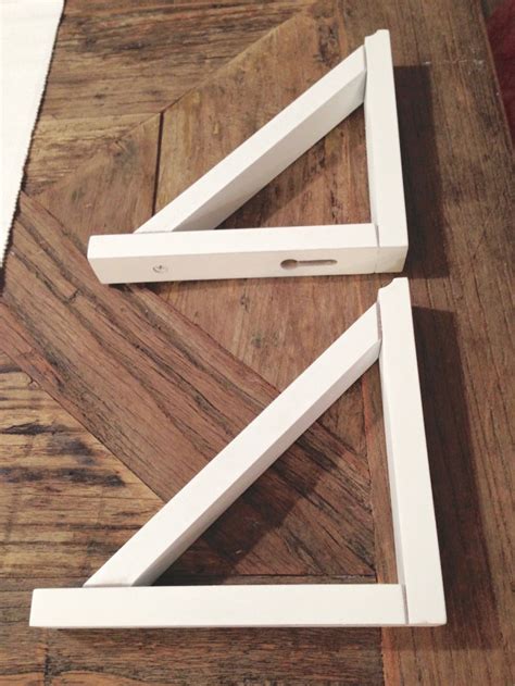 They're both functional and stylish to suit the different needs out there. DIY Shelves with Gold Brackets