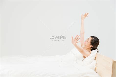 The Young Woman Stretched Herself On The Bed Picture And Hd Photos