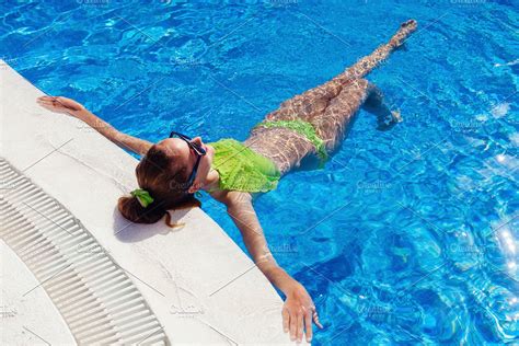 Teen Girl Relaxing Near Swimming Pool High Quality People Images