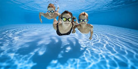 Three Happy Kids Swimming Underwater In Pool Pool Troopers