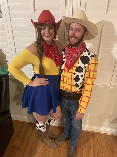 A Man And Woman Dressed Up As Toy Story Characters Including Woody The