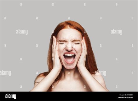 Angry Stressed Hysterical Redhead Woman With Mad Emotional Face