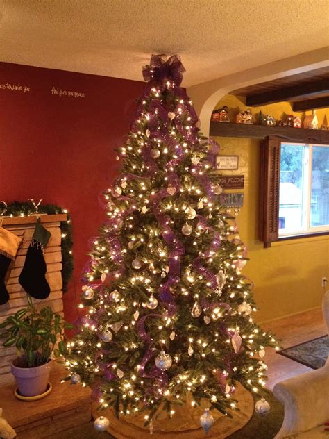 Maybe you would like to learn more about one of these? I did purple, gold, and silver ornaments, white lights ...