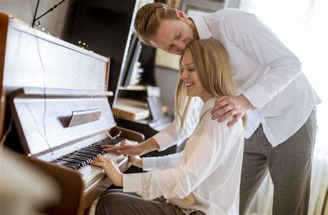 Loving Young Couple Playing Piano Stock Image Image Of Piano