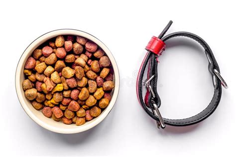 Dry Dog Food In Bowl On White Background Top View Stock Photo Image