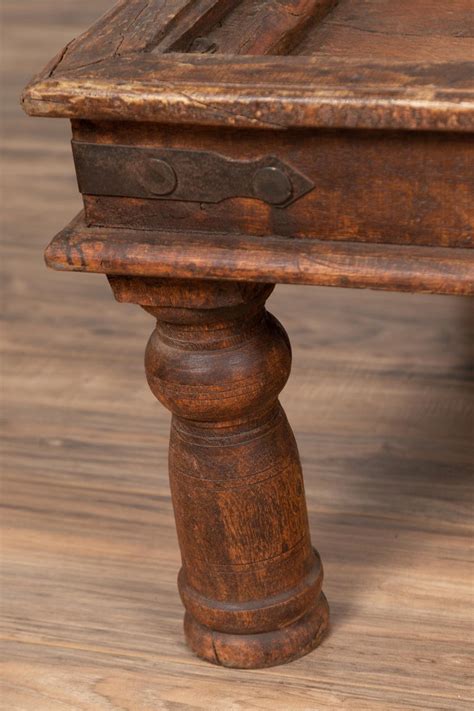 Now get upto 85% off on selected furniture. Antique Sheesham Wood Indian Palace Door Made into Coffee Table with Iron Studs For Sale at 1stdibs