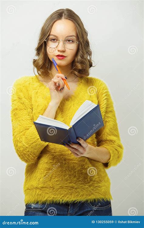 Isolated Portrait Of Thoughtful Girl With Diary And Pen Stock Image