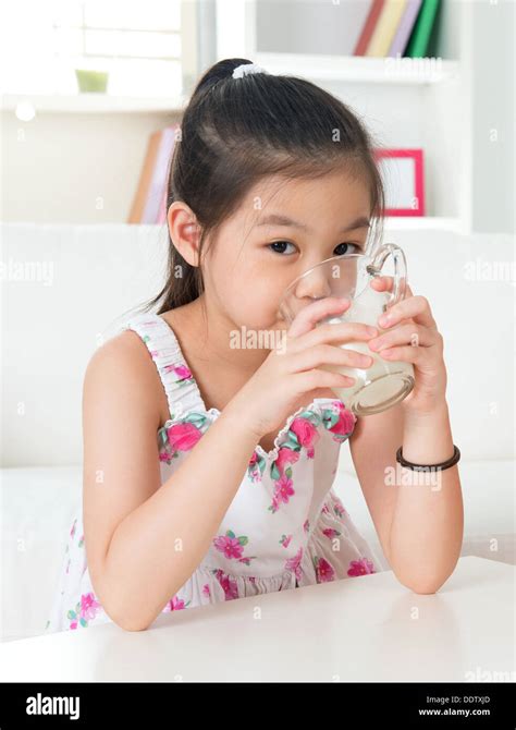 Drinking Milk Happy Asian Kid Drink Milk At Home Beautiful Child