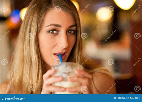 Woman In Restaurant Drinking Milkshake Stock Image Image Of Smile