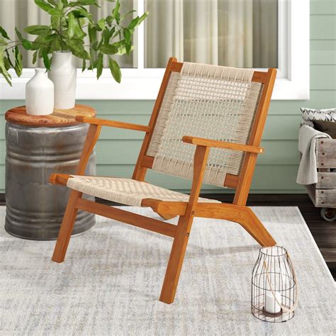 A Solid Wood And Woven Rope Patio Chair So Cute Youll Consider