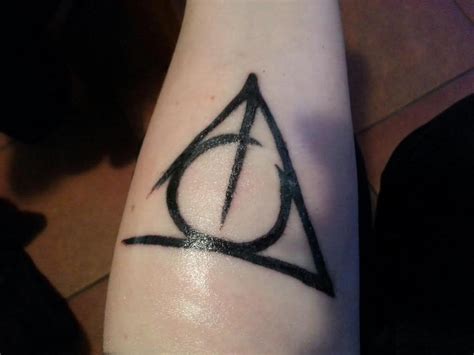 Tiny Simple Deathly Hallows Tattoo On Side Neck By Twixie09