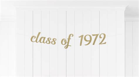 A Class Of 1932 Banner With Gold Foil Lettering On White Wood Paneling