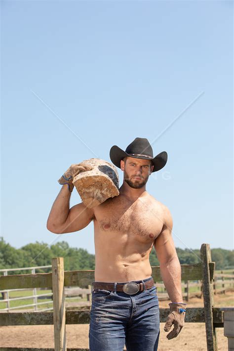 Shirtless Cowboy Carrying Wood Rob Lang Images