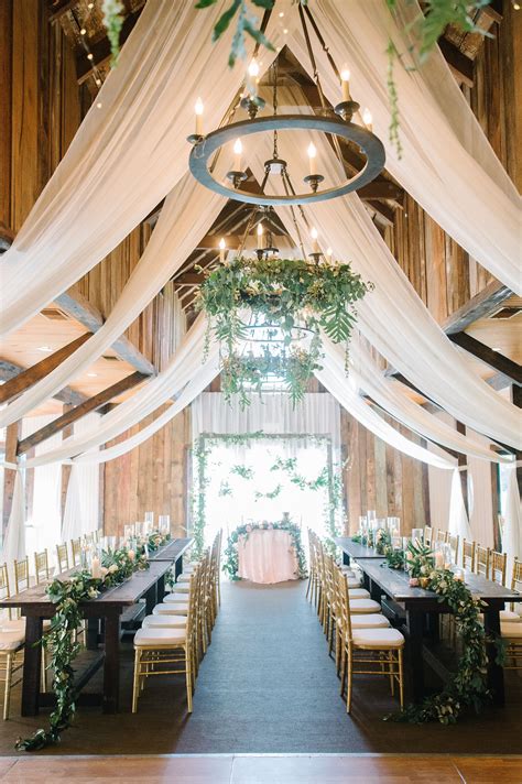 Wedding Reception Venue With Curtains Greenery And Soft Bulb