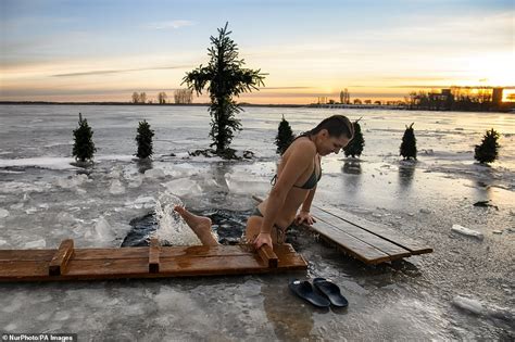 Orthodox Christians Plunge Into Icy Waters For Epiphany Celebration Despite