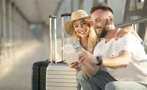 Happy Couple Taking Selfie In Airport Waiting For Boarding Stock Image Image Of Holding