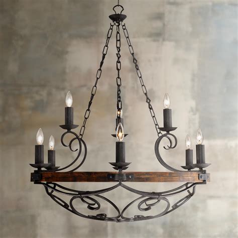 The hardwood flooring topped by a rug, white and black walls are just perfect with each other. Madera 34 1/2" Wide Black Iron Hand-Forged Chandelier ...