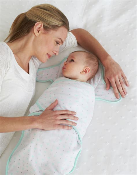 A baby just born at the hospital rests in a hospital bassinet crib, wrapped in a swaddle and wearing a beanie hat.getty images. Just Born: The Best Thing Next to Baby…Guaranteed ...