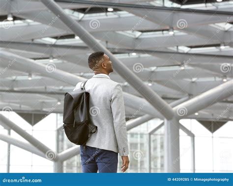 Black Man Standing Alone In Airport With Bag Stock Image Image 44209285