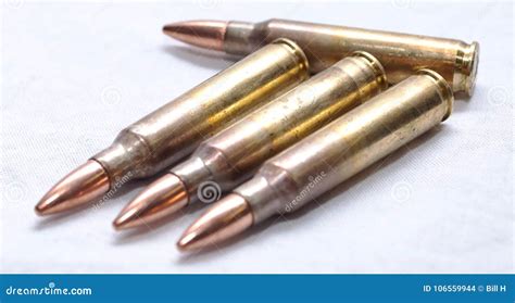 Four 223 Rifle Bullets On A White Background Stock Photo Image Of
