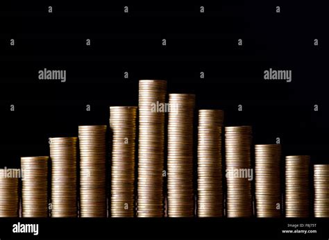 Golden Coins In High Stacks Stock Photo Alamy
