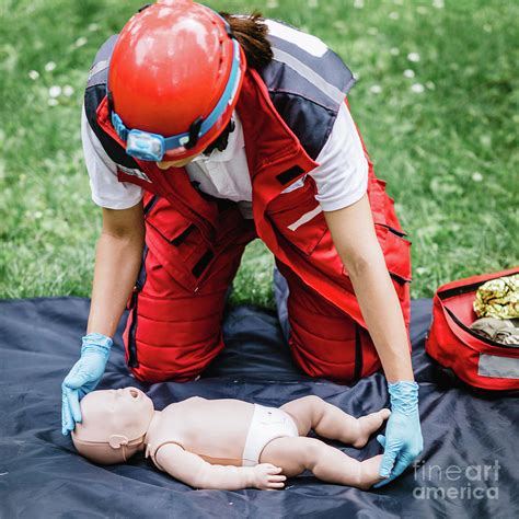 Cpr Training On Baby Dummy Photograph By Microgen Imagesscience Photo