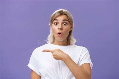 Waist Up Shot Of Overwhelmed Excited And Surprised Attractive Urban Female In White T Shirt
