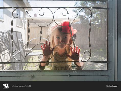 Girl Pressing Her Face On A Screen Door Stock Photo Offset