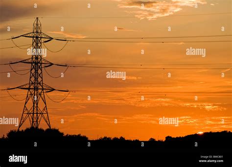 Electricity Pylon At Sunset Stock Photo Alamy