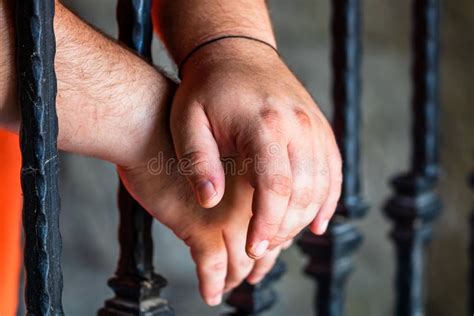 Prisoner Man Holding Hands On Jail Bars Hands On Prison Bars Stock