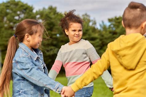 Happy Children Playing Round Dance At Park Stock Image Image Of Black