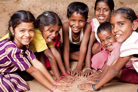 Group Of Cheerful Rural Indian Children Joining Hands We Love Yoga