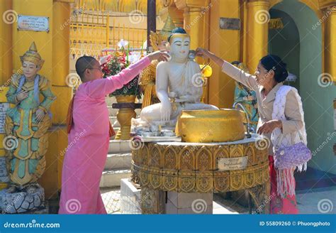 Buddhist Devotees Bathing Buddha Statues At Shwedagon Pagoda Editorial