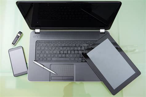 Laptop With Tablet And Smart Phone On Glass Table Stock Photo Image