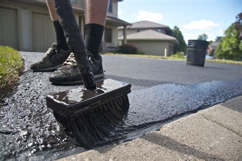 A Coal Tar Based Sealant Is Applied On A Driveway Driveway Sealer