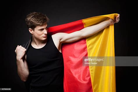 Young Man Holding German Flag High Res Stock Photo Getty Images
