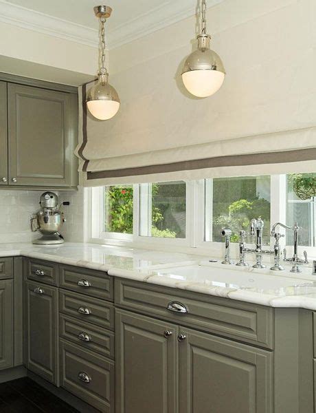 To make them work, darker kitchens and kitchen cabinets require more design skill. Kitchen with dark wood floors, taupe cabinet, white marble ...