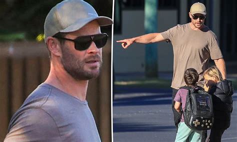 Chris Hemsworth Displays His Bulging Biceps In A Tight T Shirt While