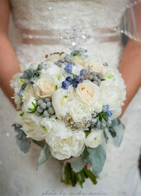 A bouquet of blue flowers, for example, romantic blue irises, can. white peonies, cream Vendela roses, white ranunculus ...