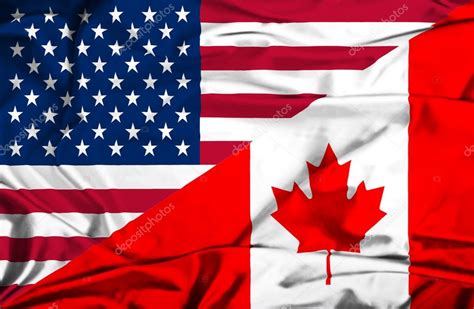 Ondeando La Bandera De Canad Y Estados Unidos Fotos De Stock Alexis