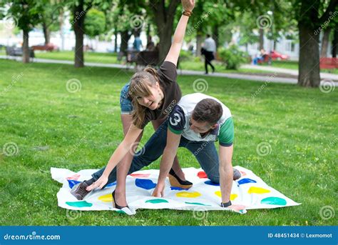 Students Play A Game In The Park Twister Stock Photo Image Of Cute