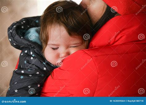 The Baby Sleeps In Her Mothers Arms After A Walk Close Up Sleeping