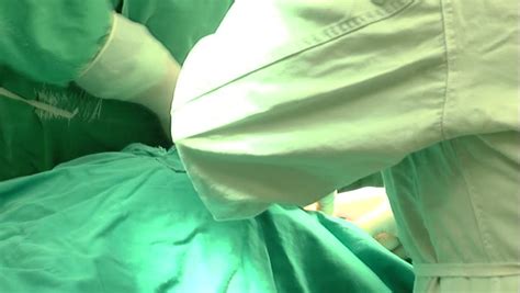 Caesarean Section Surgeon Cutting Stomach With Scalpel