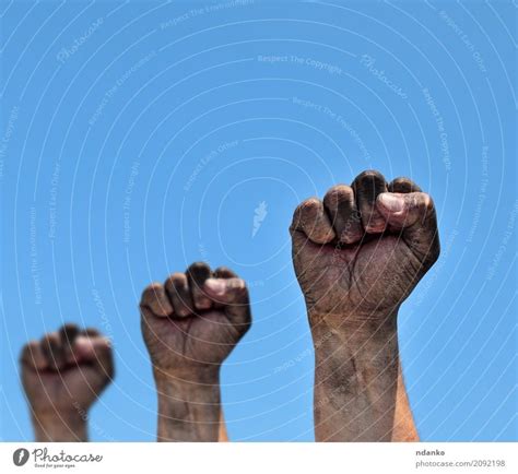 Three Dirty Male Fists Raised Up A Royalty Free Stock Photo From