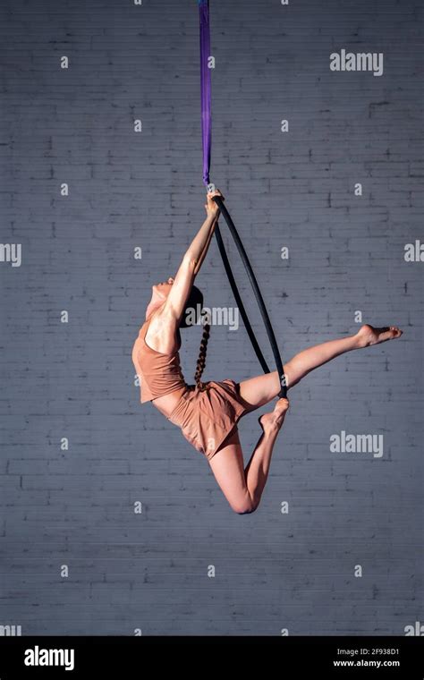 Female Circus Aerialist Acrobat Training On The Hoop Strong Woman